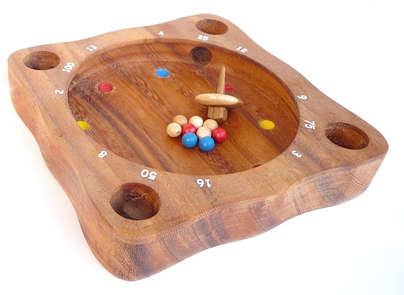 Board Games: Rollele Roulette ball spinning board game for the whole family.